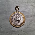 Azes and Pallas Athena Swivel Pendant: (Obverse view showing Azes) Silver tetradrachm 50 BC-5 AD set in hand-braided 18 kt. gold border; handcrafted 18 kt. gold bezel and swivel; approximate size 41mm long and 30mm in diameter.