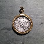Azes and Pallas Athena Swivel Pendant: (Reverse view showing Pallas Athena) Silver tetradrachm 50 BC-5 AD set in hand-braided 18 kt. gold border; handcrafted 18 kt. gold bezel and swivel; approximate size 41mm long and 30mm in diameter.