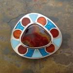 Belt Buckle II: Champleve enamel on silver with silver and gold leaf; designed, laid out, and pierced by hand; Kentucky agate, set in handmade and riveted silver bezels; 2.75" x 2.375" x 3 mm.
