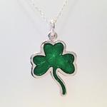 Shamrock Pendant: Green transparent enamel on silver with gold leaf; Pendant size, 40mm high x 28mm wide x 3mm thick.