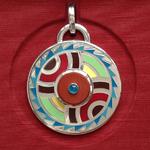 Mandala III: Enamel on silver, African red jasper, neon blue apatite; 2.25" in diameter, weighing 3.66 ozs.
